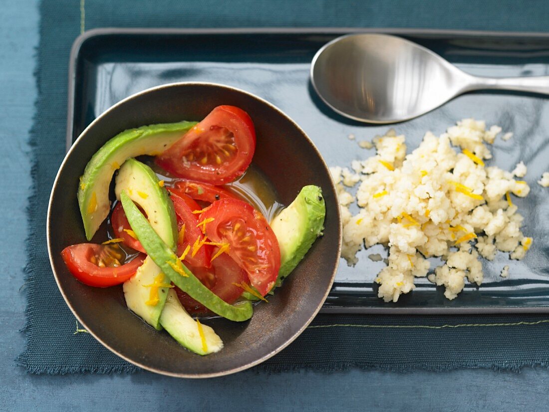 Orange couscous with avocado & tomato salad