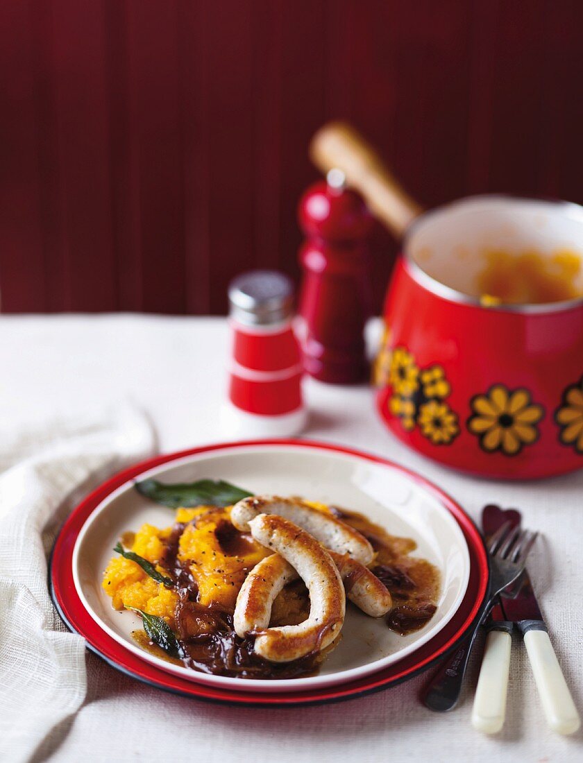 Turkey sausages with pumpkin puree and onion sauce