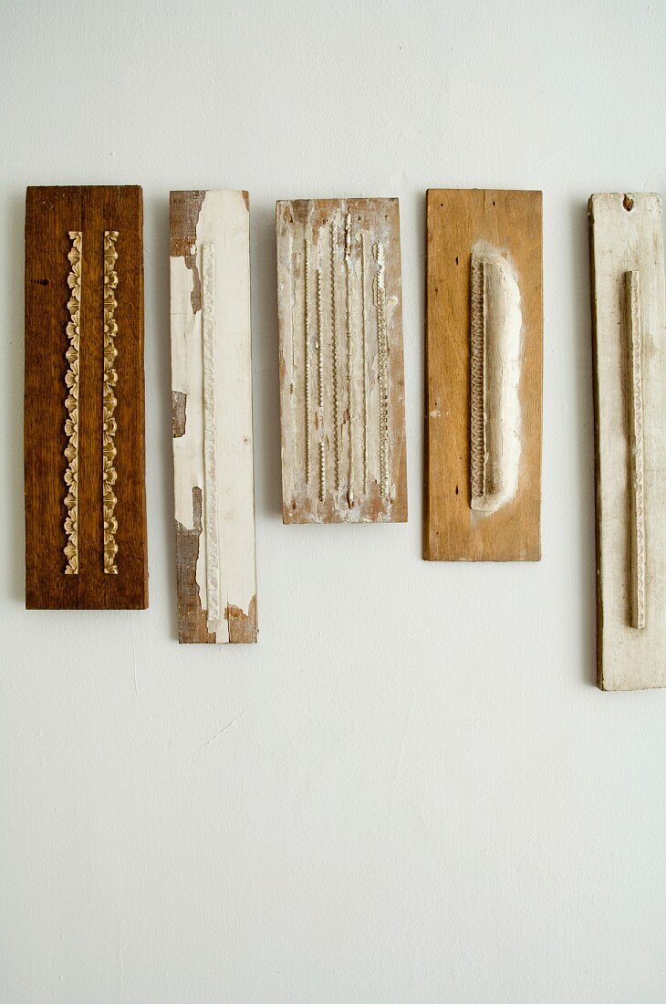 Decorated strips of wood on wall