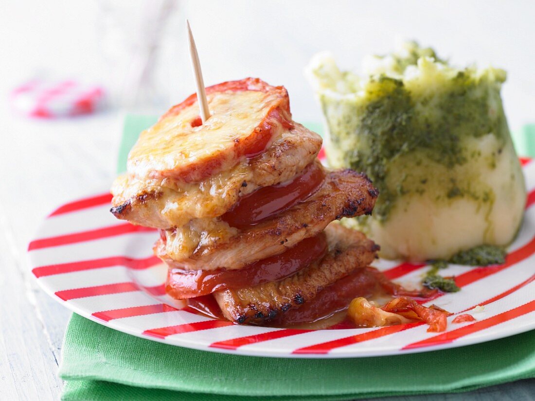 An escalope tower with pesto and potato purée