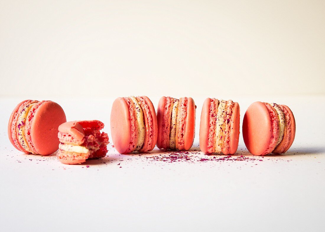 Pink macarons with white ganache and raspberry jam