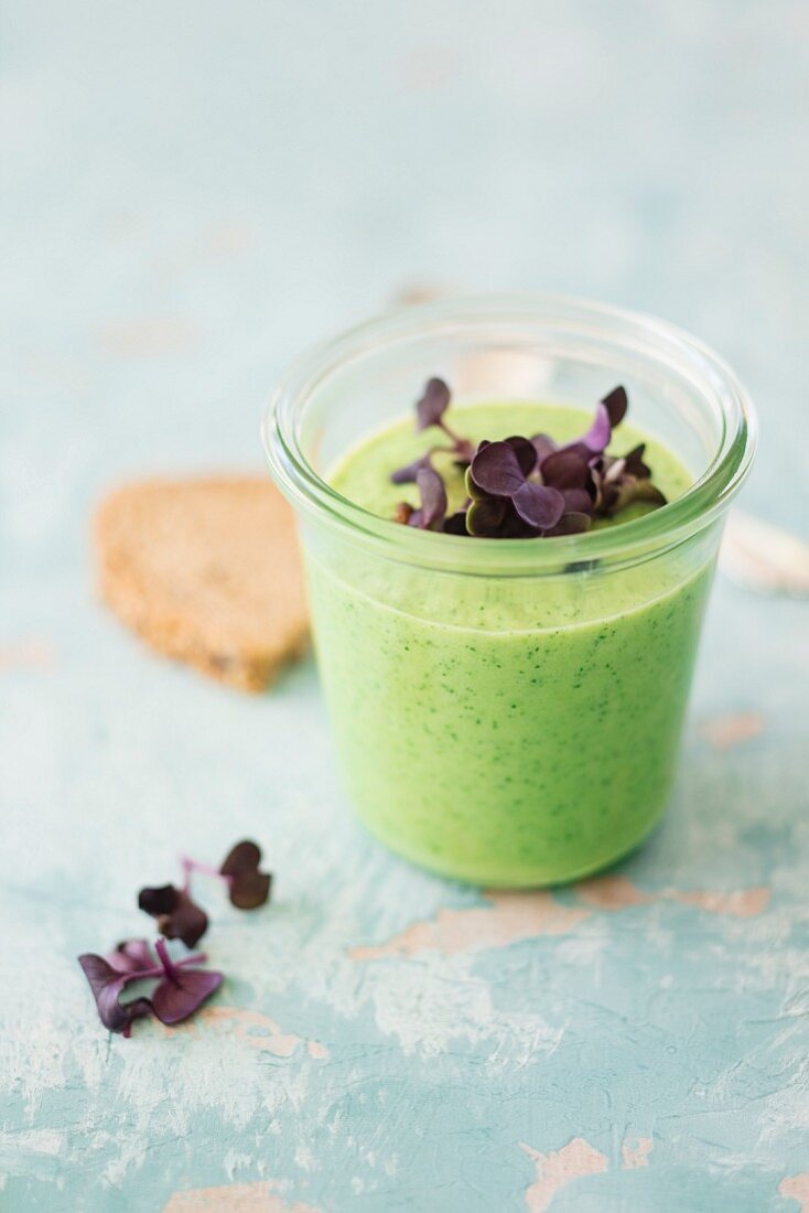 Vegan creamy courgette soup with soya cream and daikon cress (low-carb)