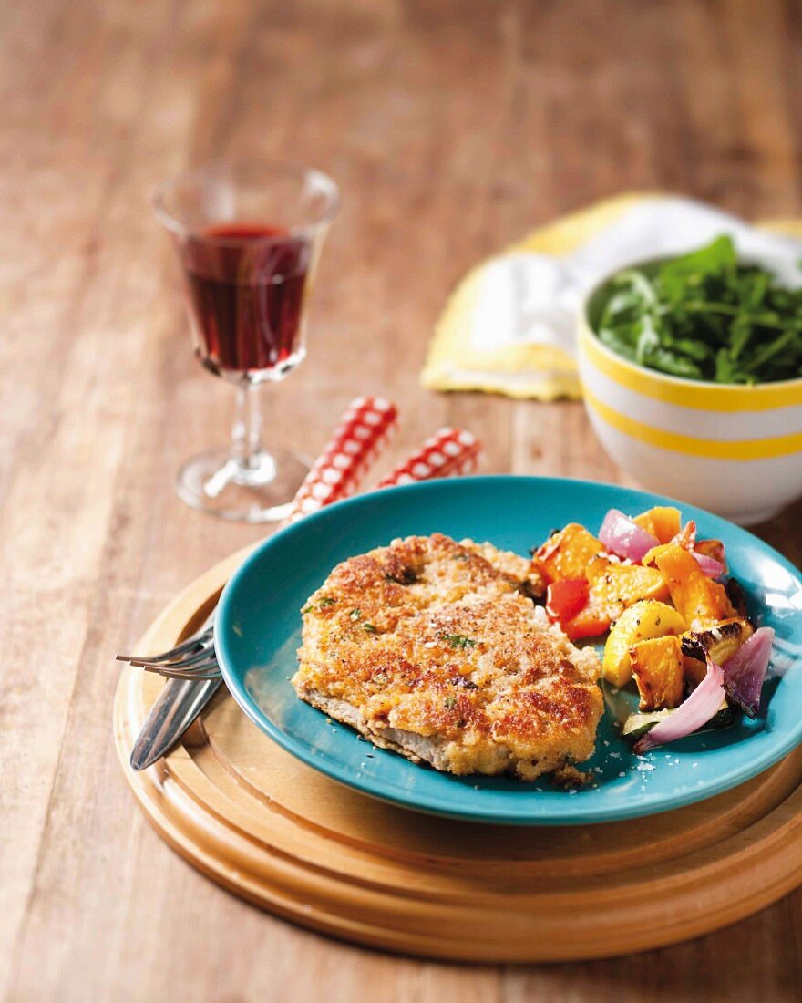 A minute steak with a lemon & Parmesan coating served with pan-fried vegetables