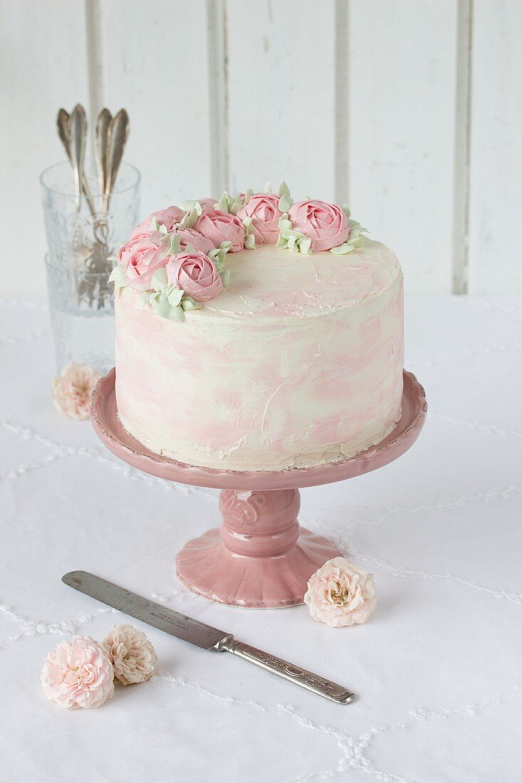 A wedding cake with buttercream roses