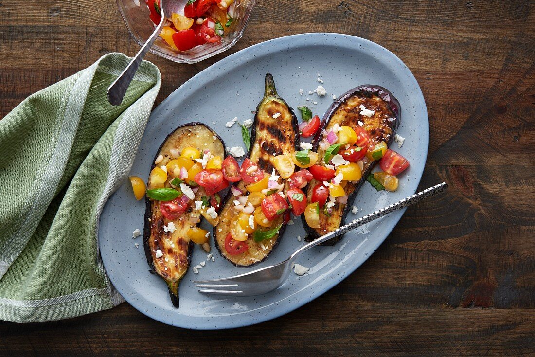 Grilled aubergine with tomato and basil