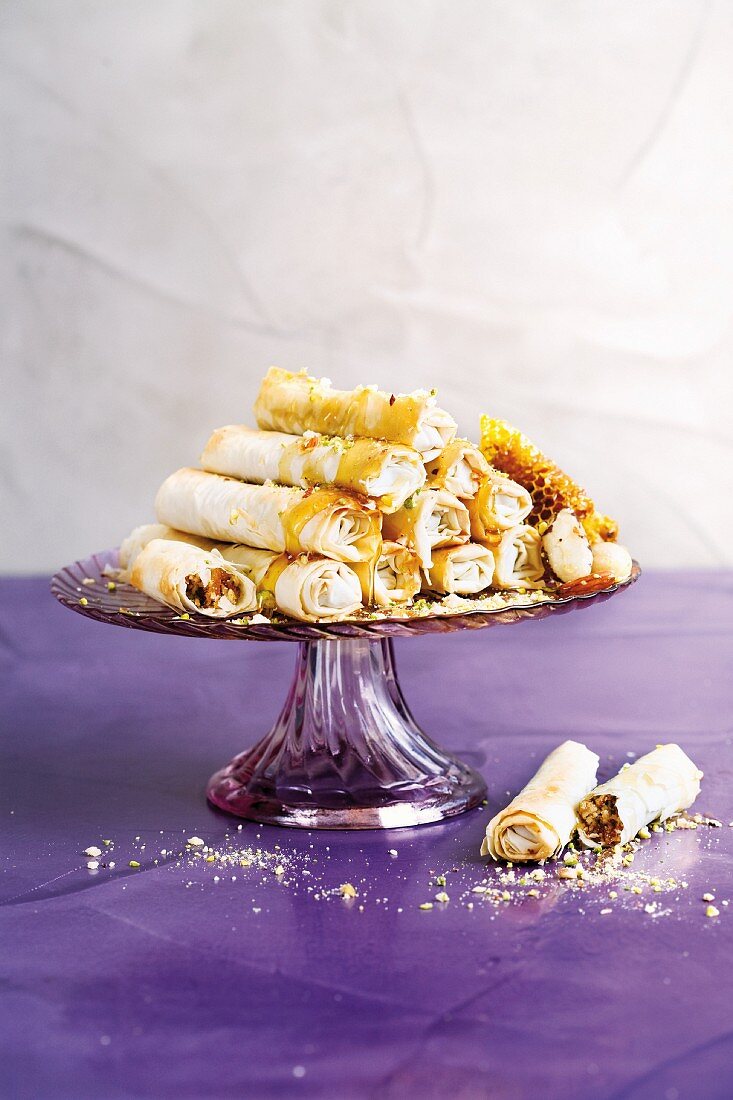 Filo pastry rolls with apricot & nut filling and honey