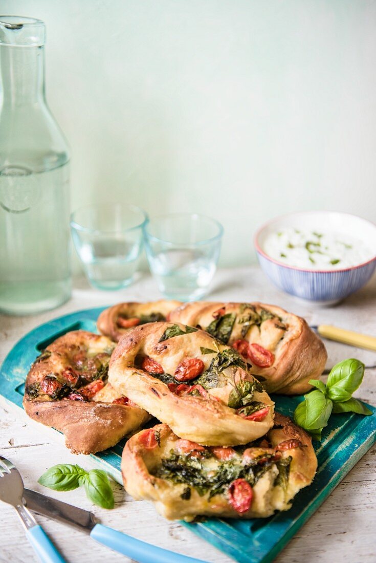 Pizza rolls with spinach, tomato and mozzerella