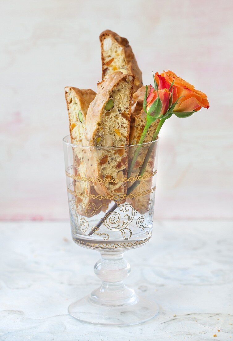 Gluten-free apricot & pistachio biscotti in a stemmed glass