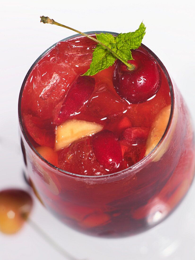 A fruity drink with cherries