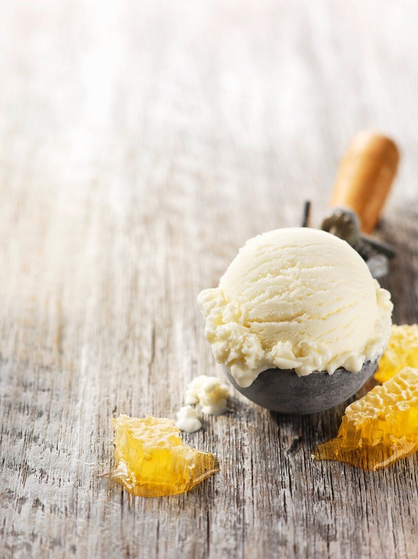 Honey ice cream in an ice cream scoop