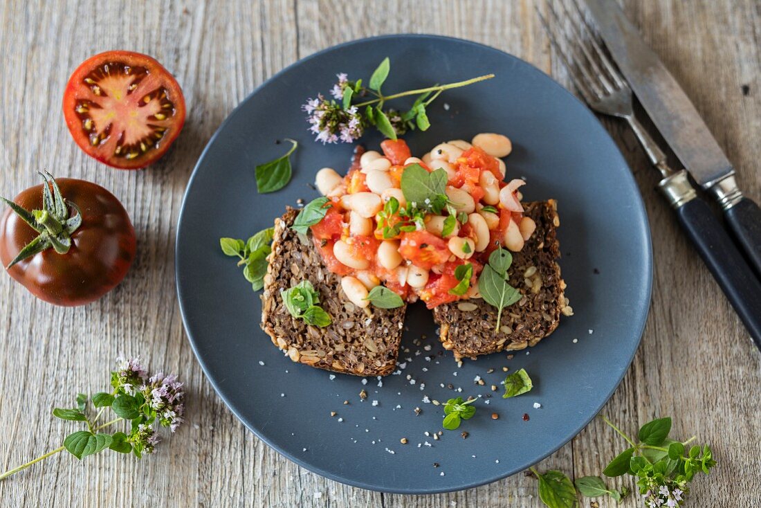 White beans and tomato on multi-grain bread