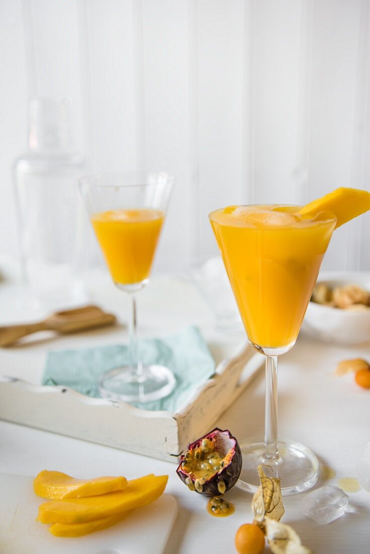 Mango & passion fruit cocktail with physalis