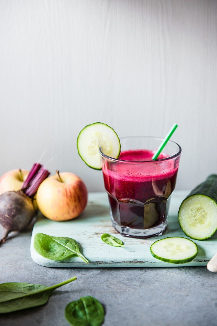 A glass of beetroot juice with cucumber, apple and spinach
