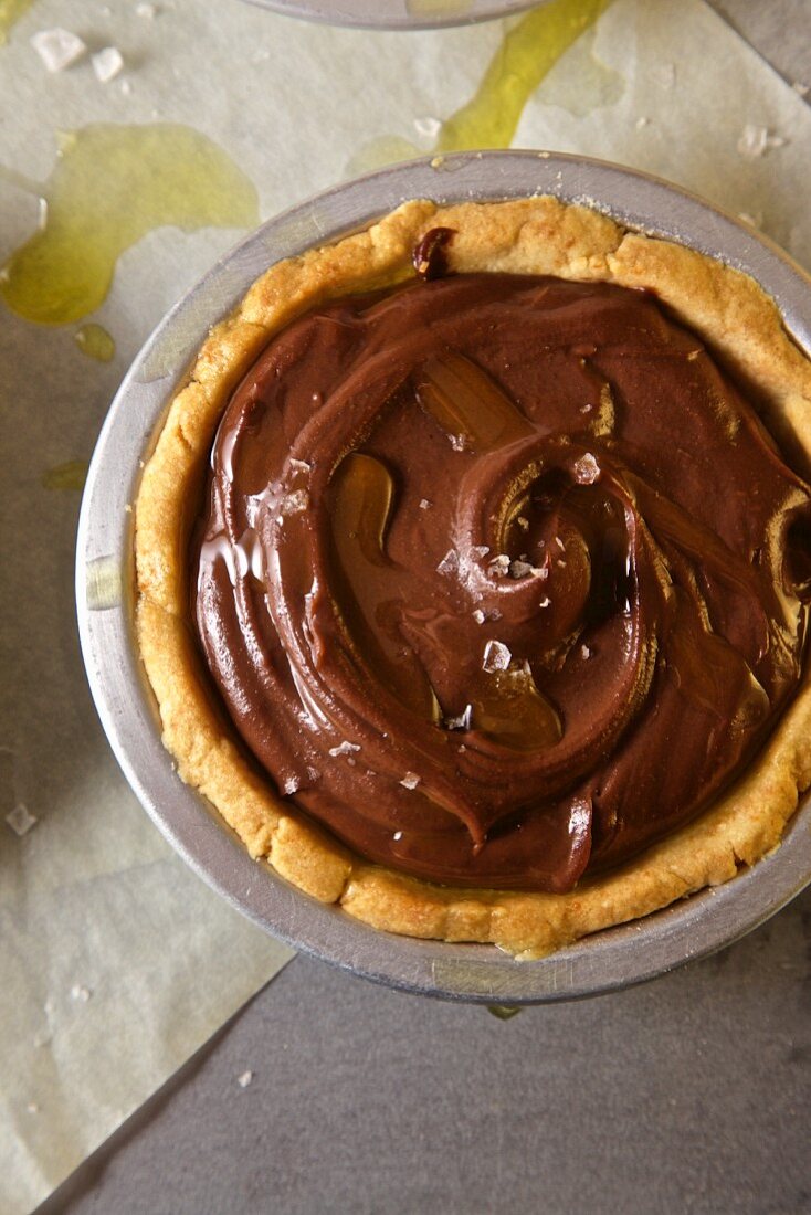 A chocolate & budino tartlet with olive oil and sea salt