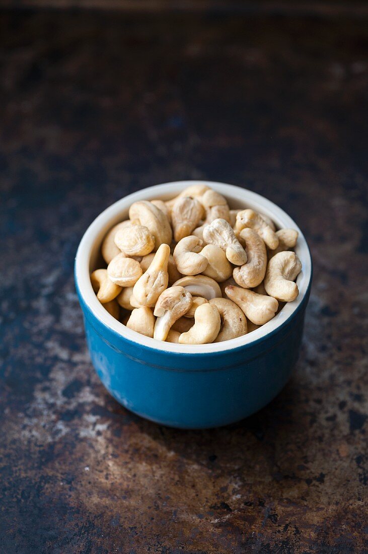 Cashew nuts in a blue bowl