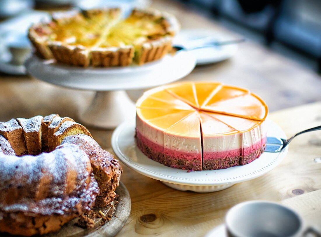 A cake buffet wuth three different cakes