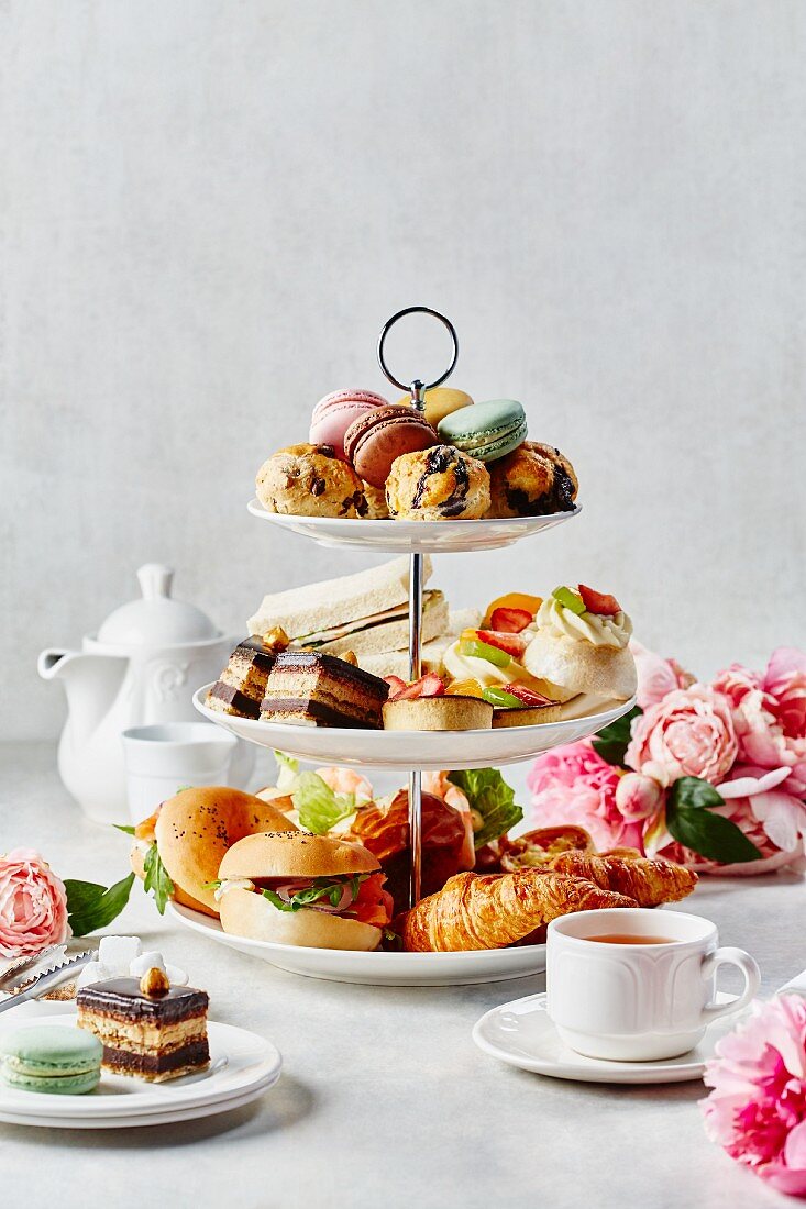 Sweet and savoury snacks on a tiered cake stand for afternoon tea