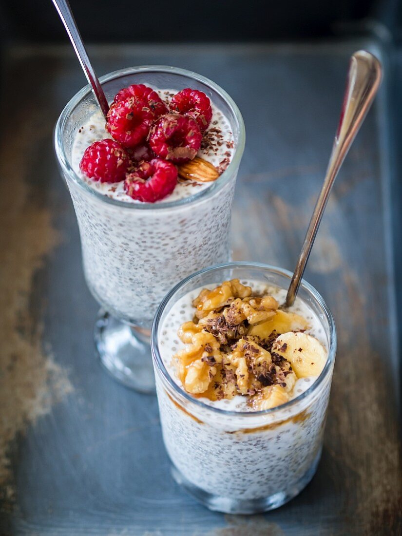 Overnight chia seed and coconut milk pudding served with fruits, nuts and dark chocolate