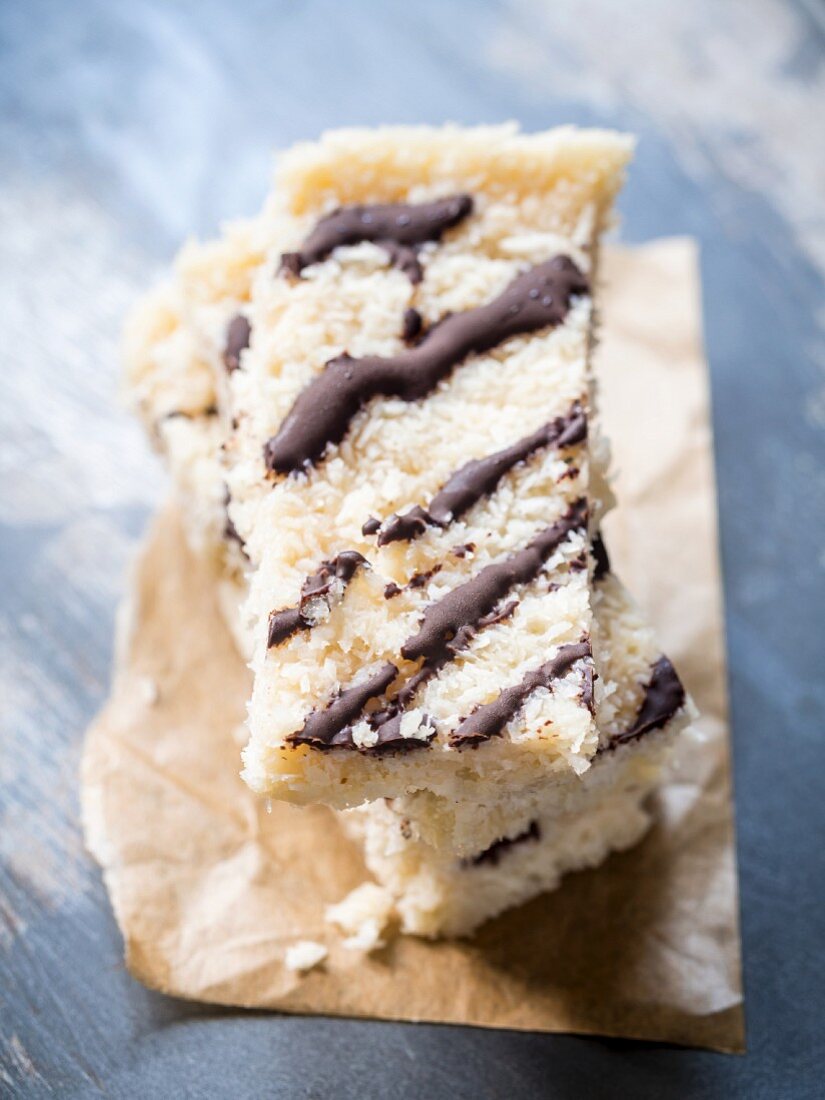 Home-made vegan coconut slices with a chocolate topping
