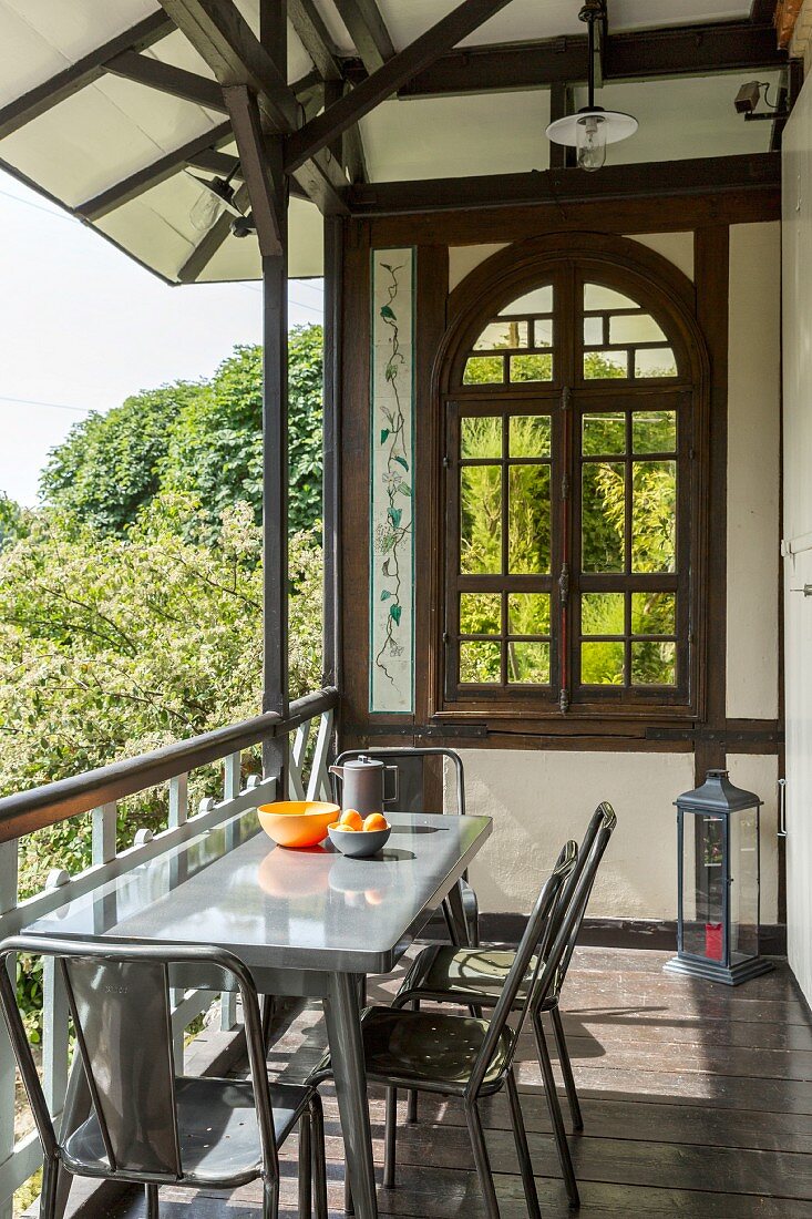 Summery loggia in half-timbered house with arched window