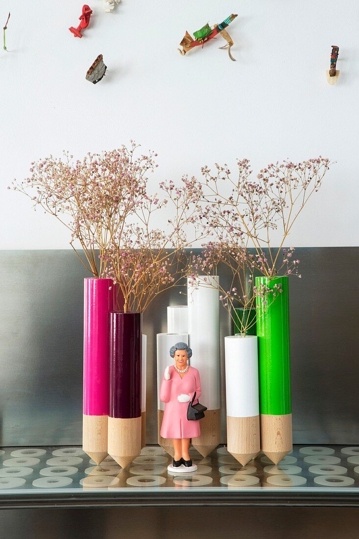 Arrangement of colourful vases and figurine of Queen Elizabeth II