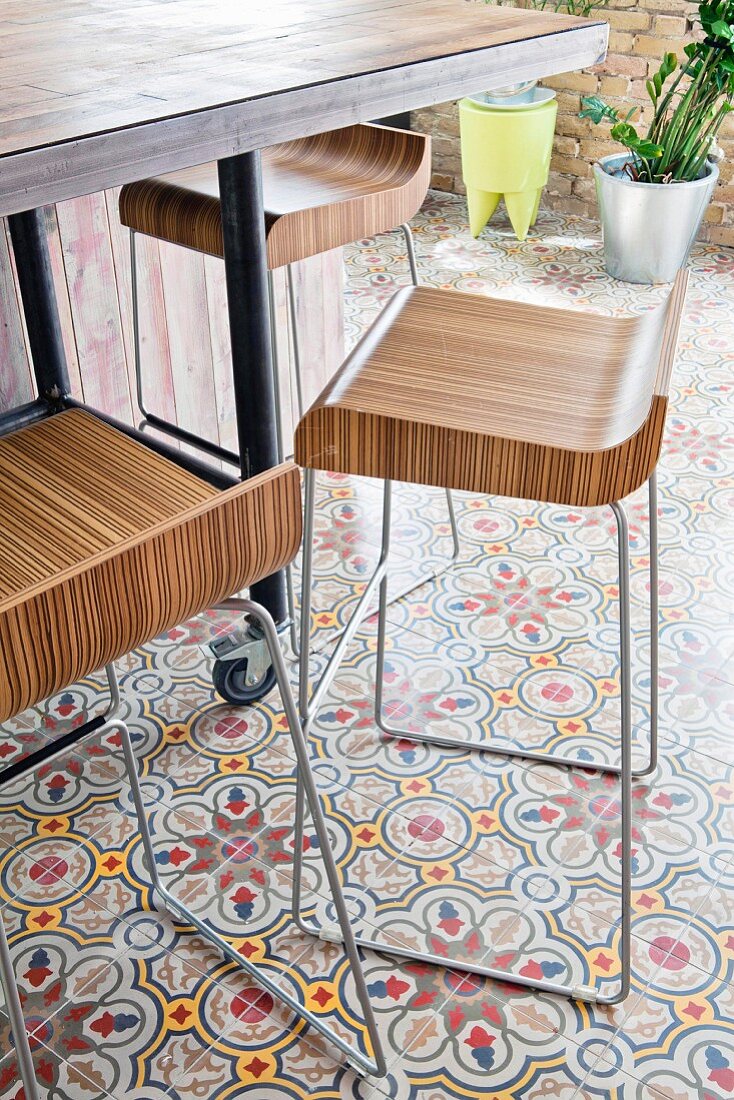 Designer bar stools on patterned cement tiles