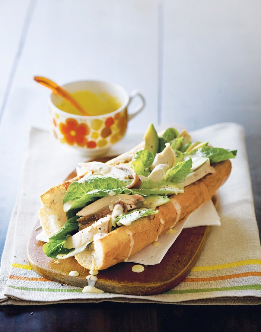 A Caesar sandwich with chicken, avocado and cos lettuce