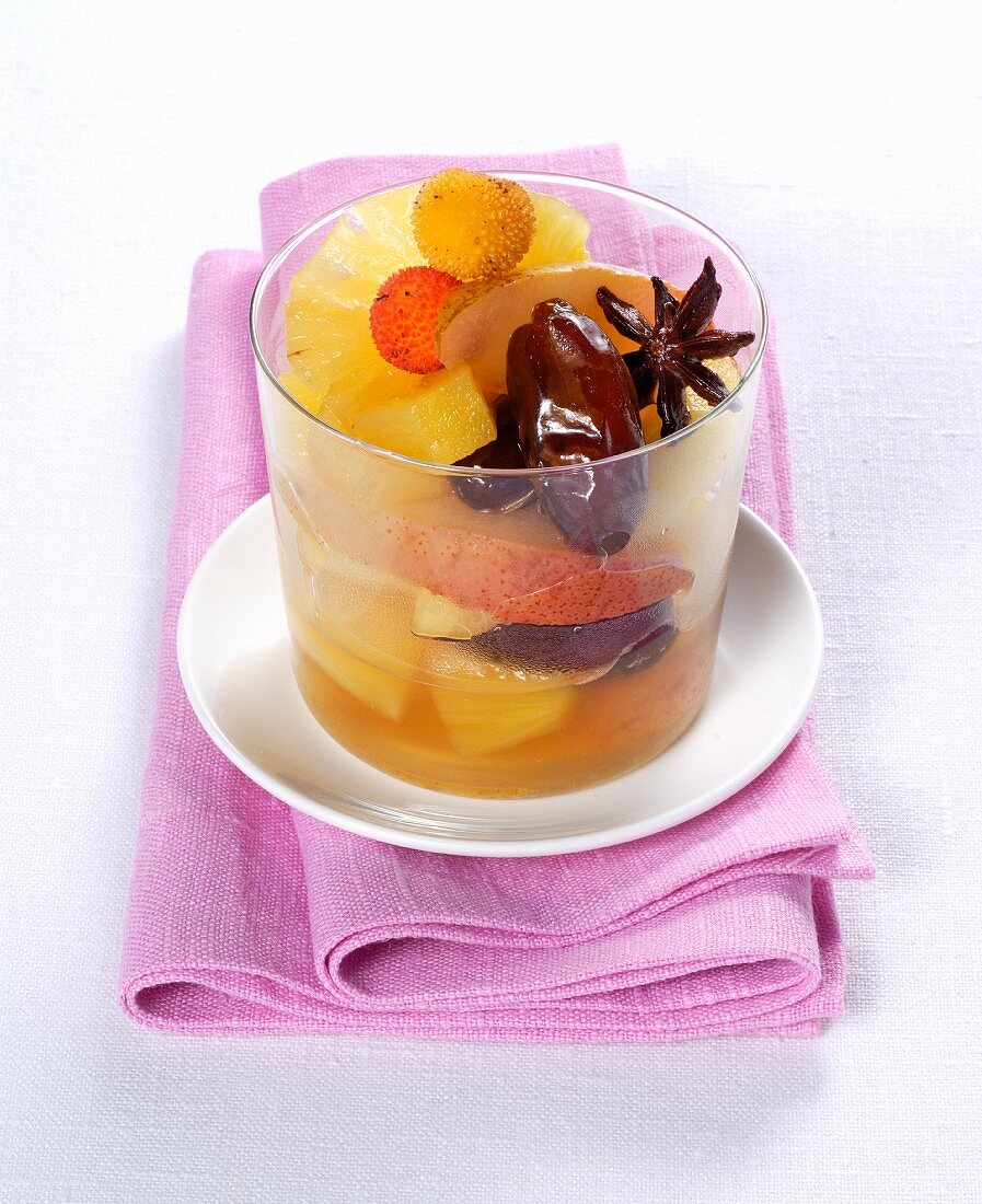 An exotic fruit salad with pineapple, dates and arbutus berries