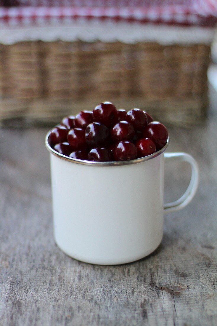 Cherries in an enamel cup