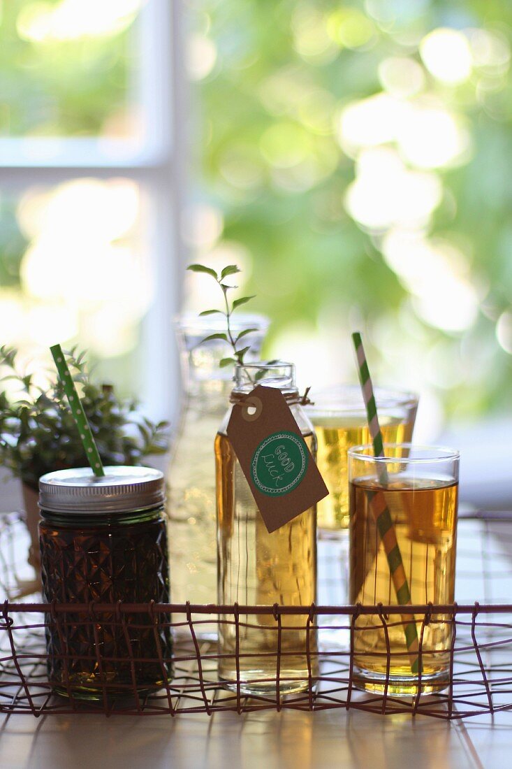 Assorted tea glasses on a wire basket tray