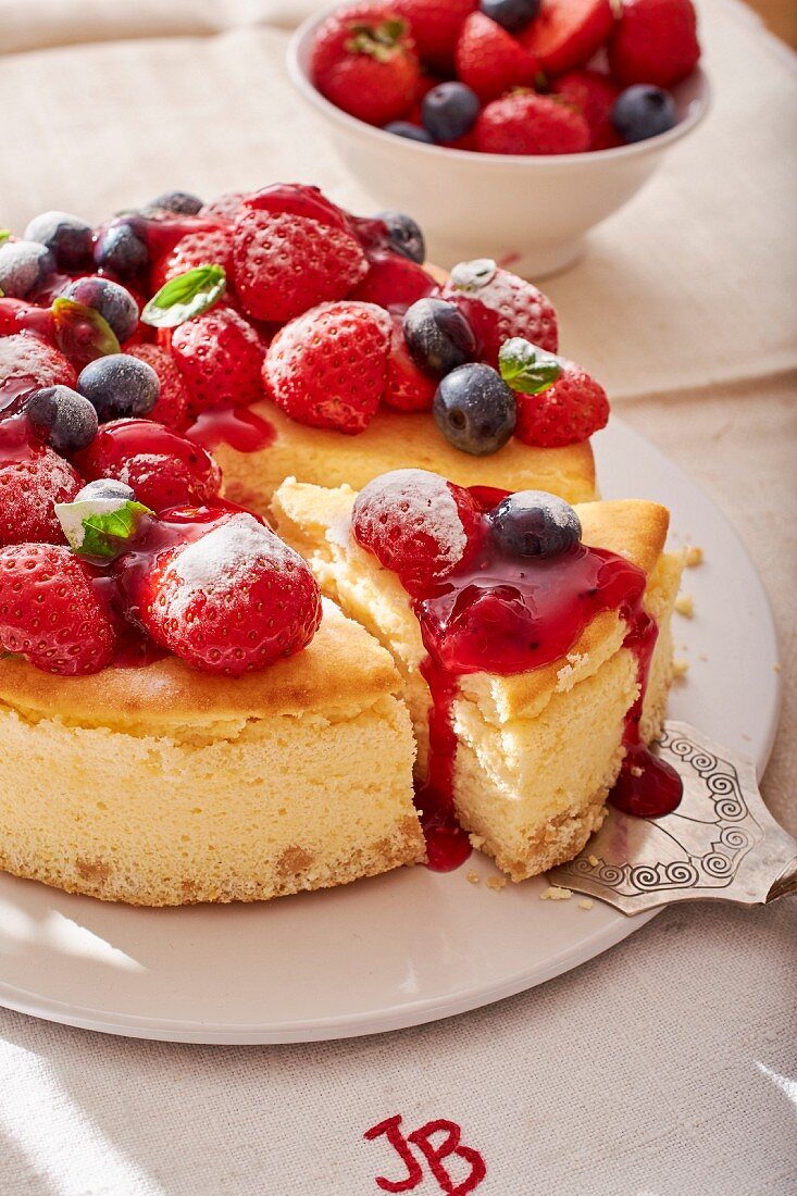 Sliced red berry cheesecake