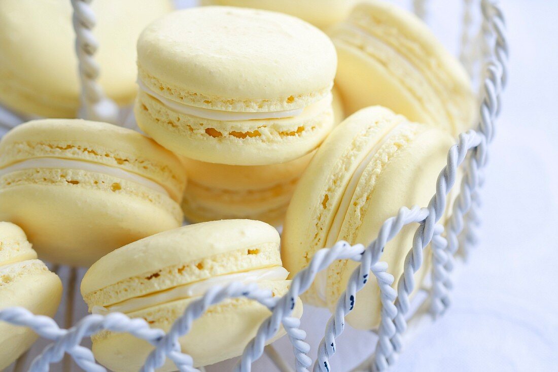 Lemon flavored macarons in a wire dessert stand