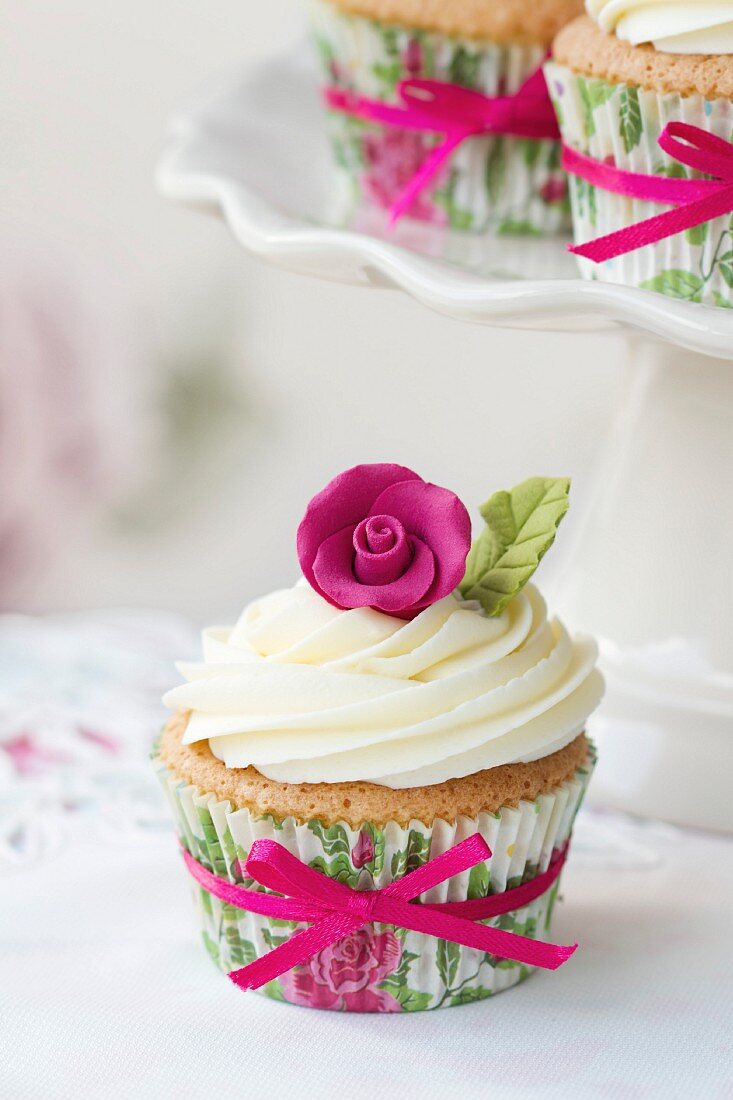 Cupcake decorated with a pink sugar rose