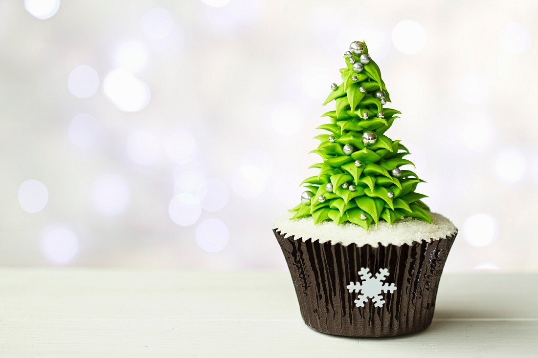 Christmas tree cupcake with copy space to side
