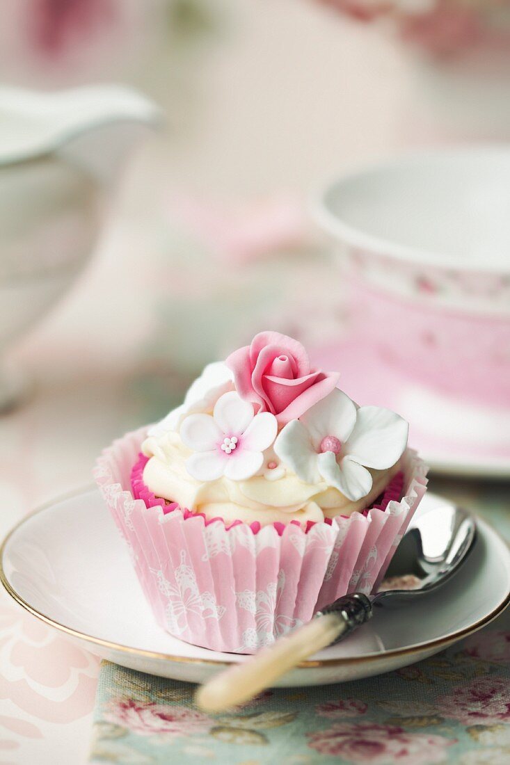 Afternoon tea served with a flower cupcake