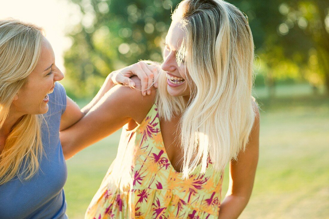 Two women laughing together