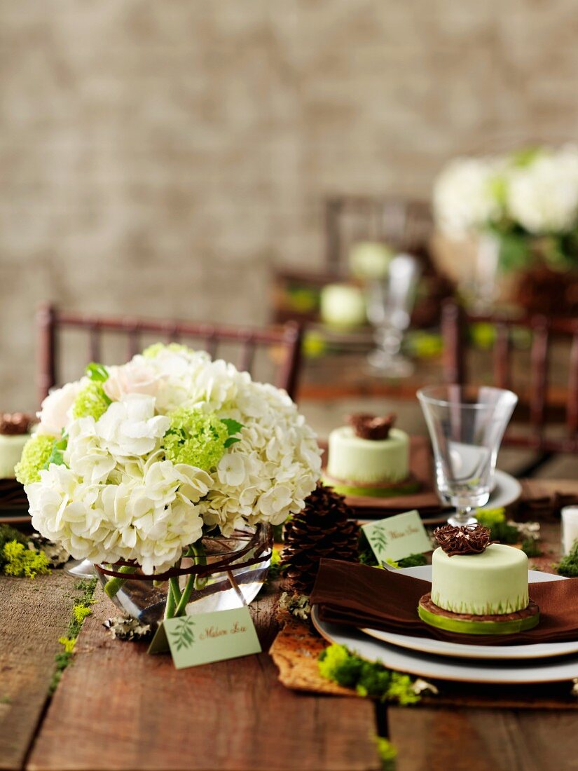 Bouquet of white hydrangeas on rustic wedding table