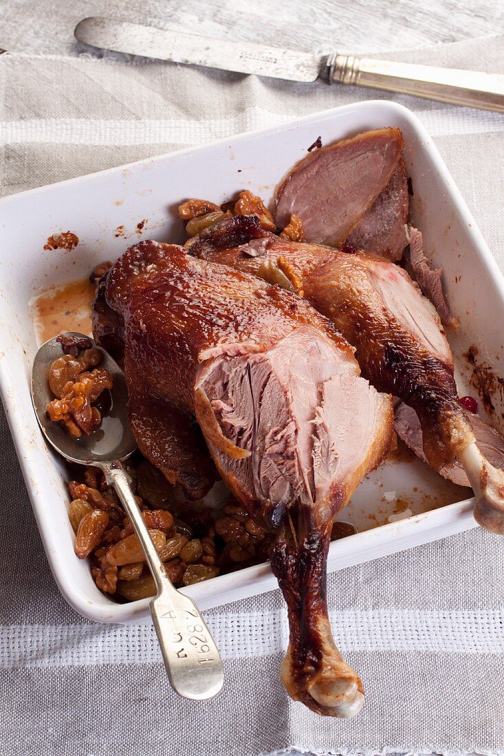 Roast legs of goose with raisins and walnuts