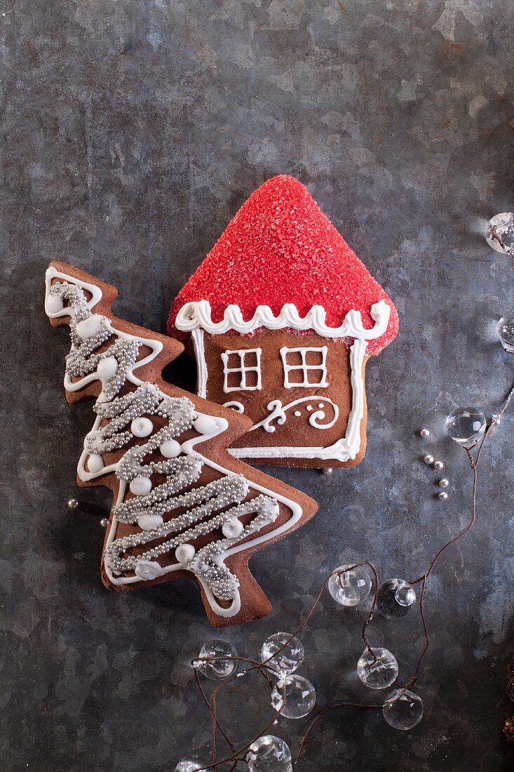 Christmas gingerbread biscuits in the shape of a house and a Christmas tree