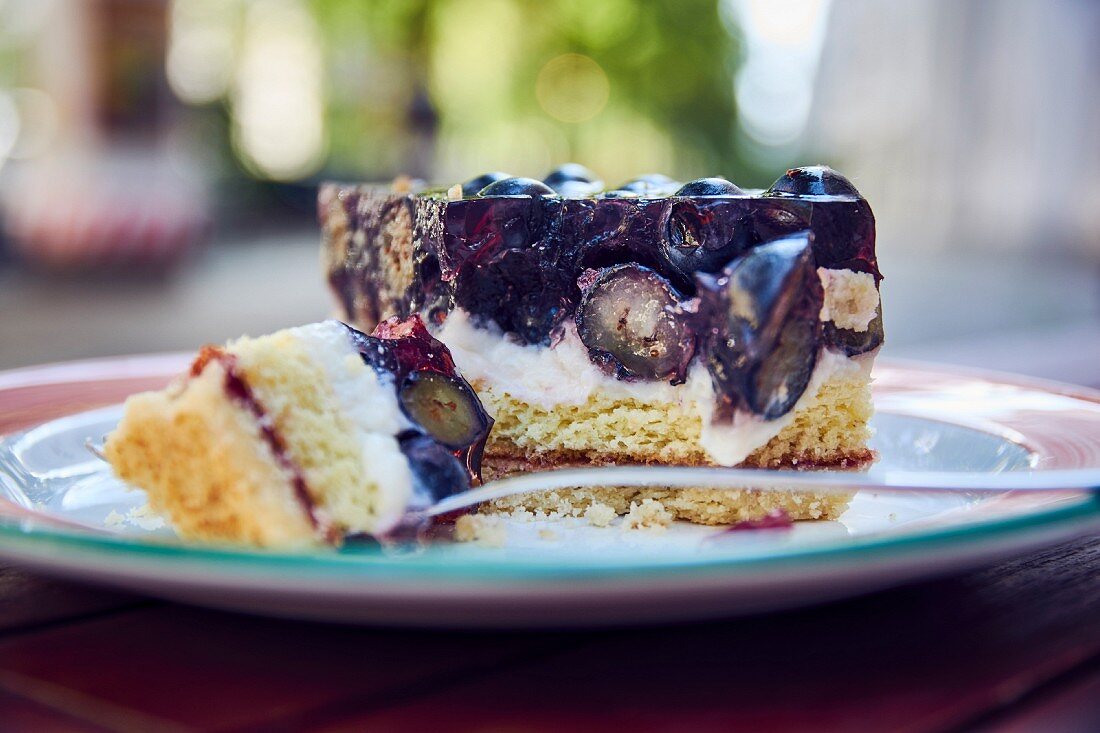 Blueberry cake with a bite taken