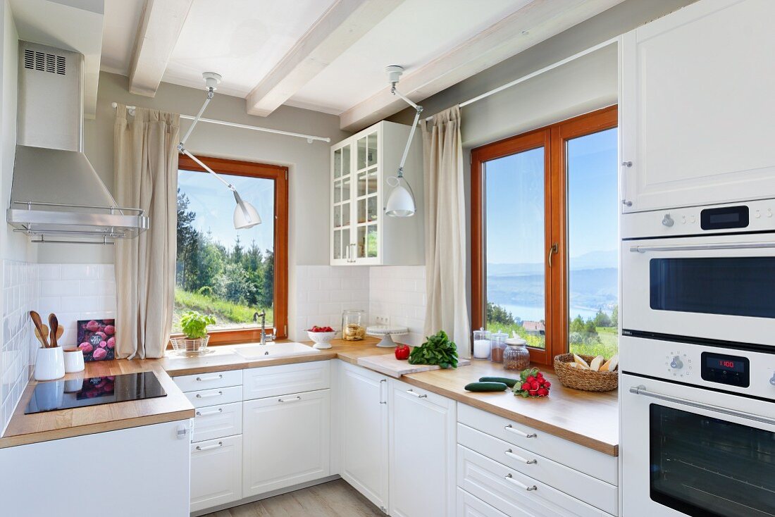 Modern country-house kitchen with view of landscape