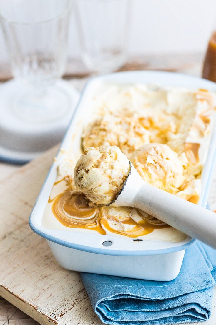 Miso & butterscotch ice cream with an ice cream scoop