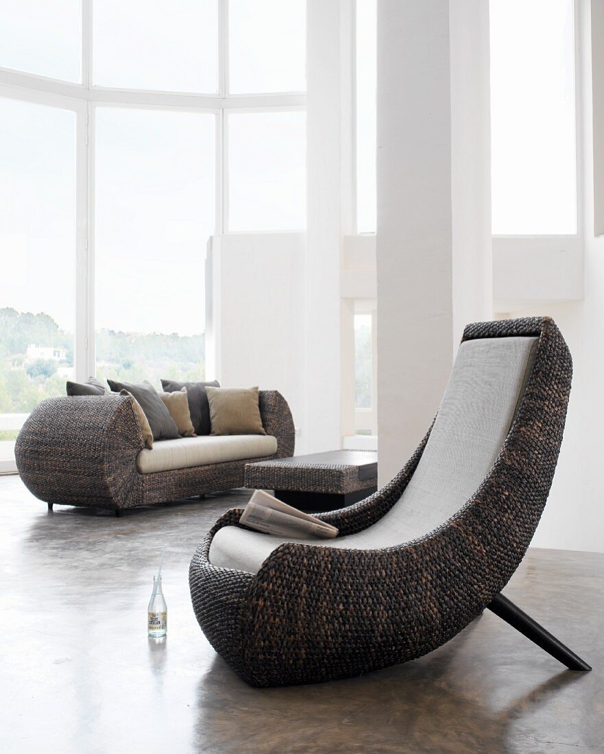 Modern wicker furniture in organic shapes in architect-designed house