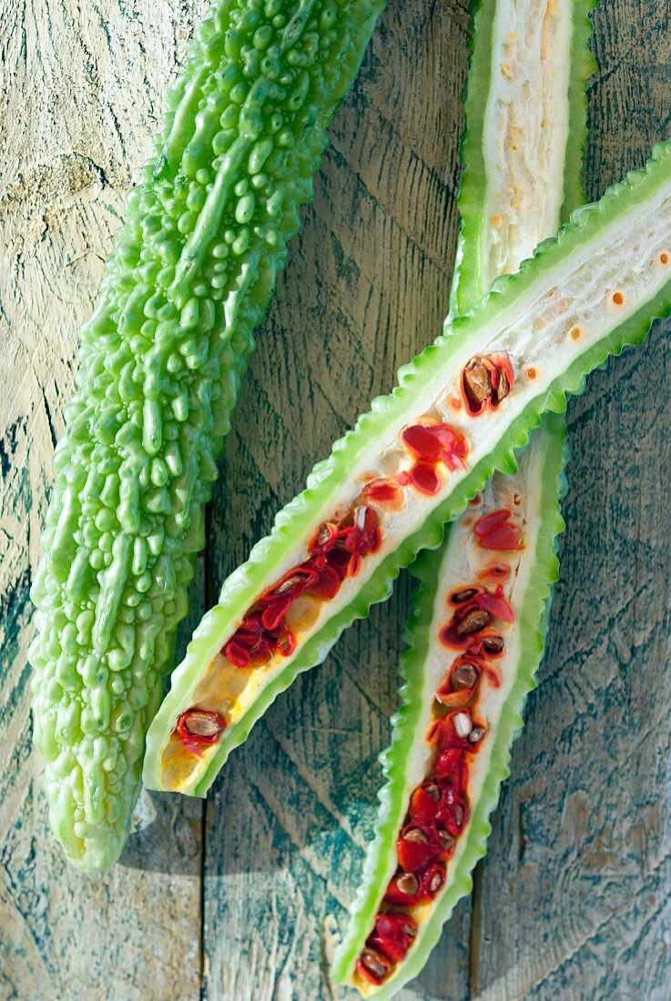 Bitter gourds, whole and halved