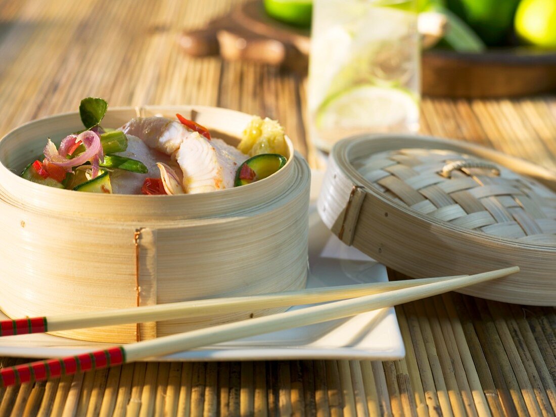 Fish and vegetables in a bamboo steamer (Asia)