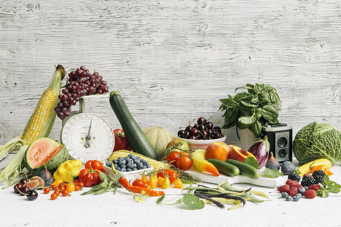 An arrangement of summer vegetables and fruit
