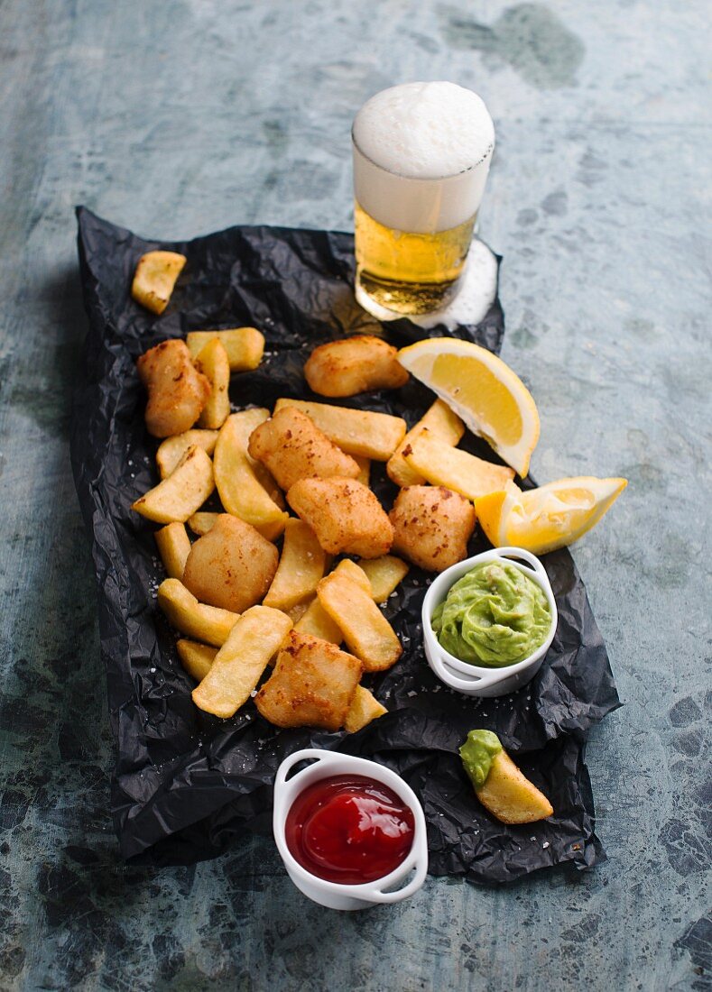 Fish and chips with avocado cream and ketchup