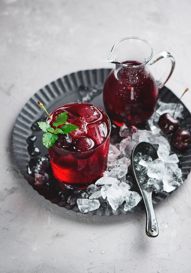 Cherry lemonade with ice cubes