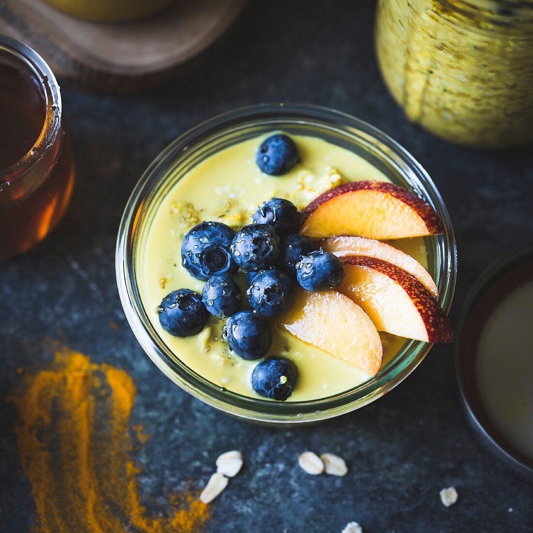 Golden milk with porridge oats with fresh fruits (gluten-free)