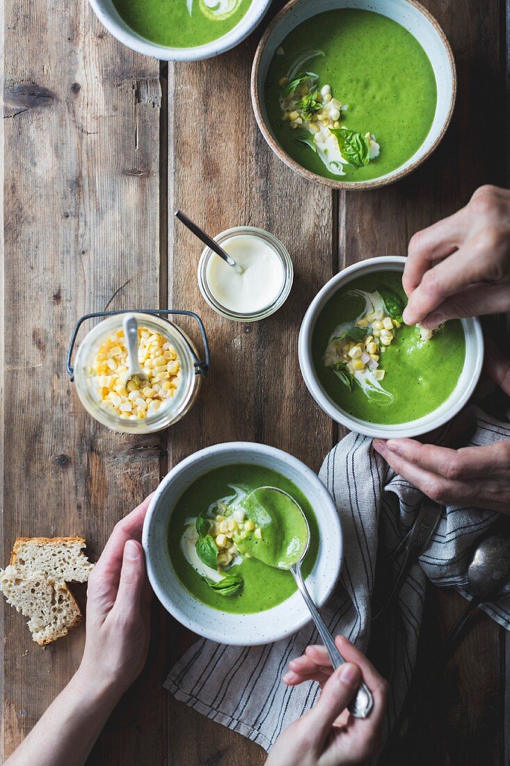 Creamy courgette & basil soup with crème fraîche and sweetcorn